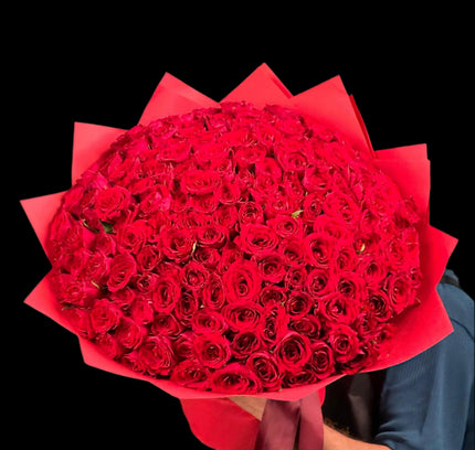 100 red roses with red wrapping