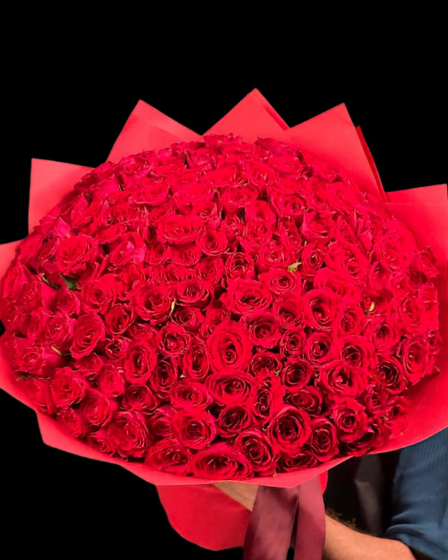 100 red roses with red wrapping