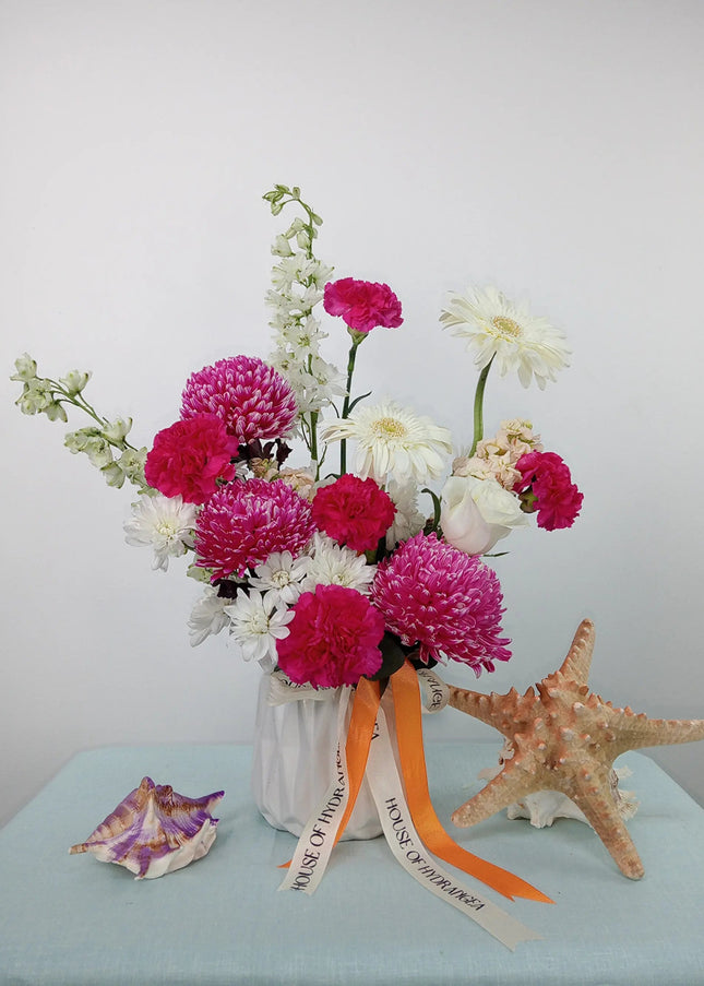 Exclusive Tangerine beach vase Flowers Premium Flower Delivery in Dubai